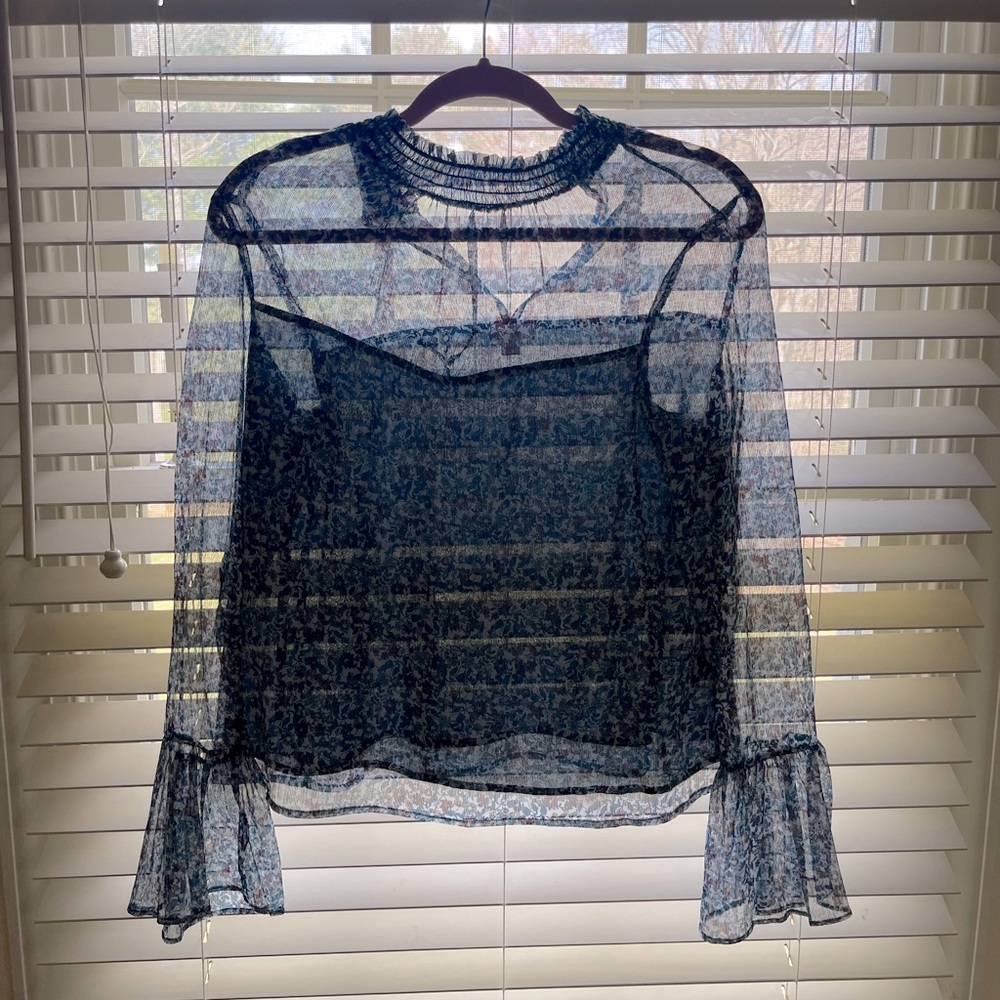 Beautiful transparent dark aqua blue blouse.